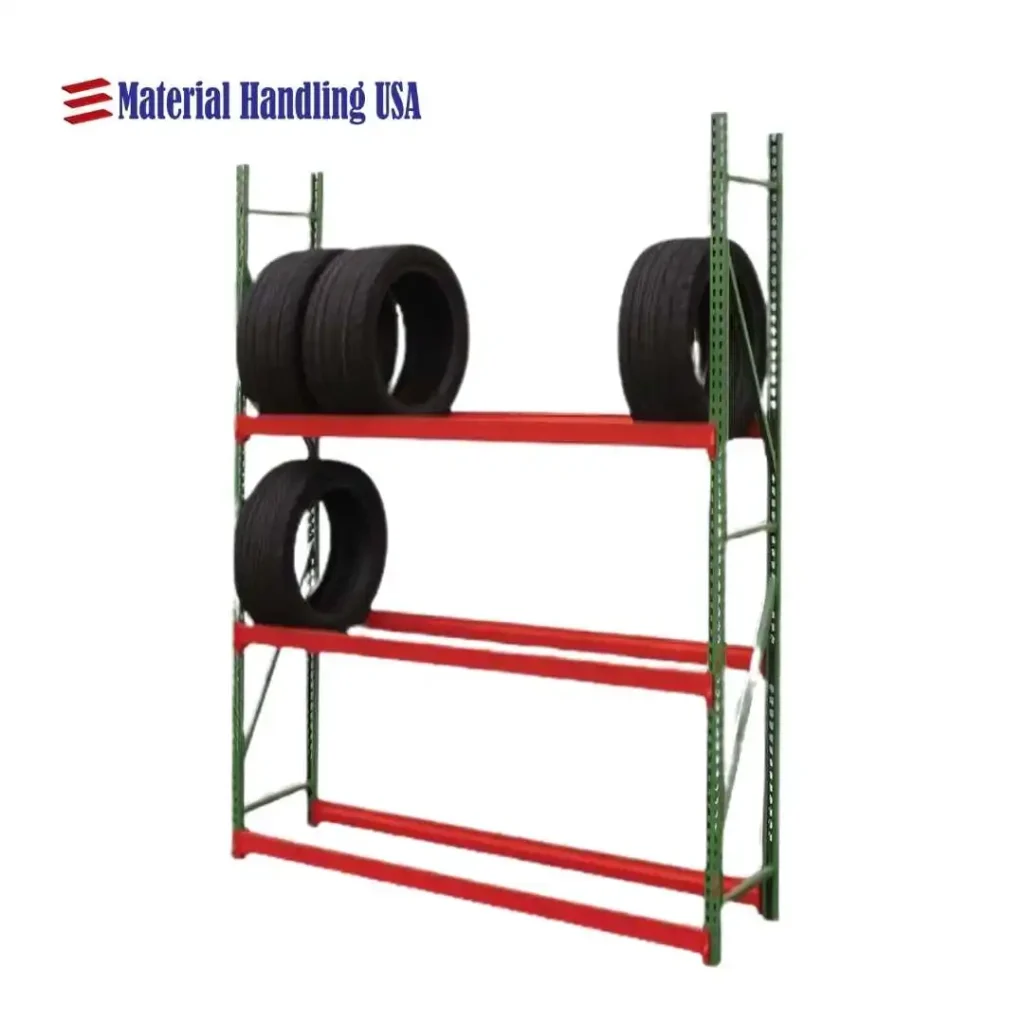 A heavy-duty green metal shelving unit with three orange shelves, perfect for retail store shelving. Four large black tires rest on the top two shelves, while Material Handling USA is proudly displayed in the corner. The bottom shelf awaits more specific shelving solutions.