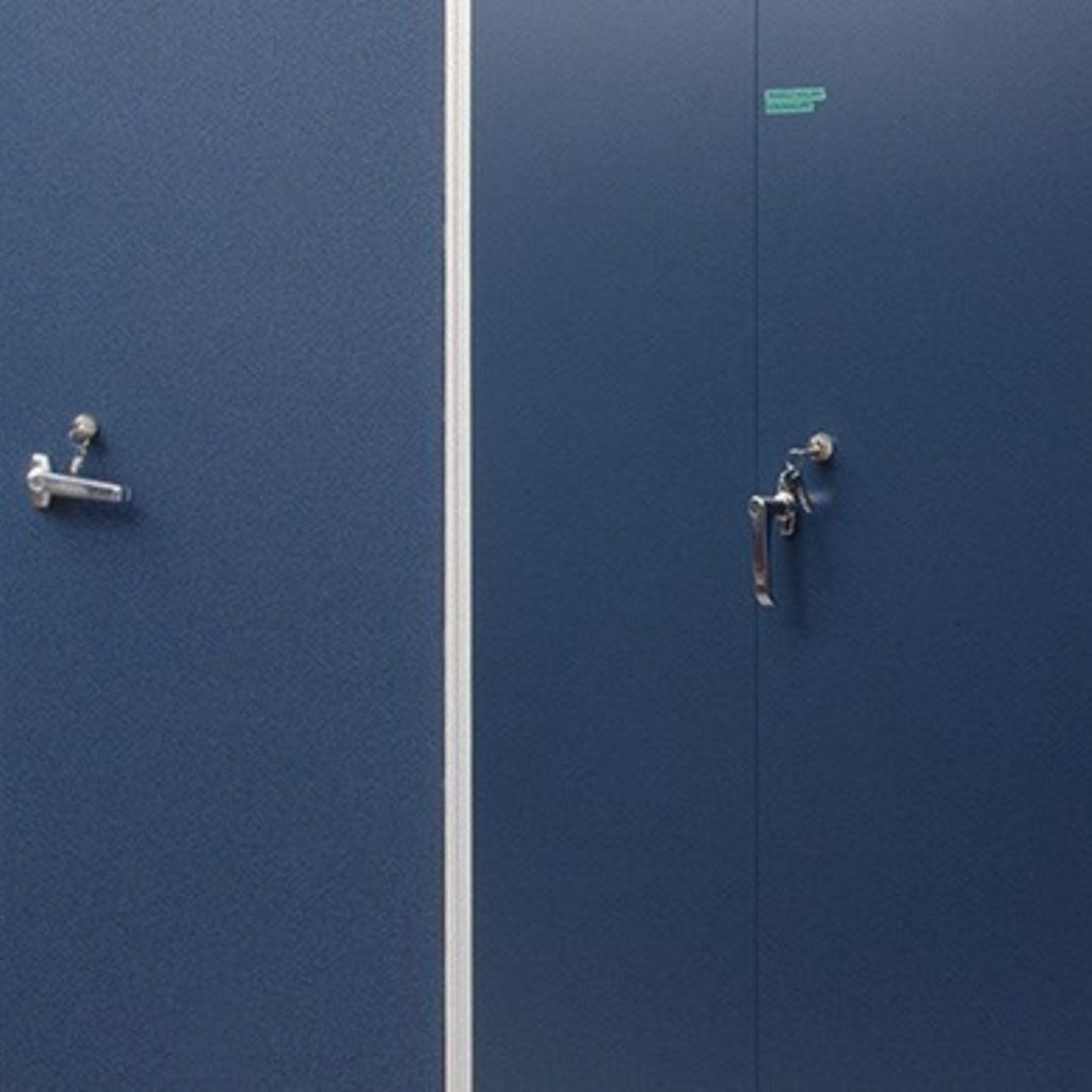 A blue door with a vertical metal handle is slightly ajar. A small sign is barely visible above the handle on the right side. The door contrasts with the slightly different shaded surface on the left, which has a closed door handle.