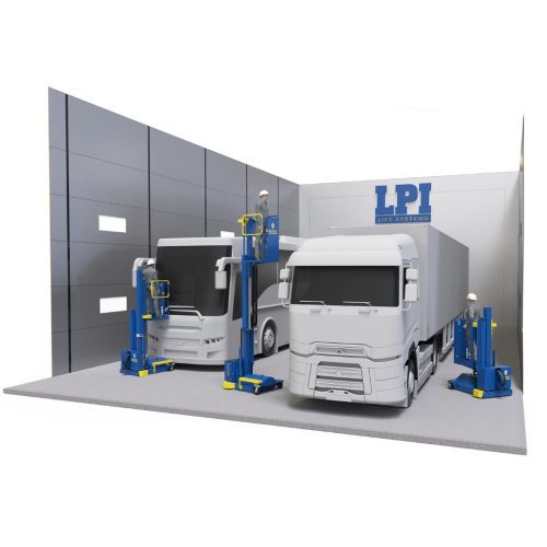 Two large white trucks are inside a modern gray-walled garage. Three workers in helmets use the BOOST™ Lift – Compressed Air-Powered Platform for Paint Booths & Hazardous Environments, labeled LPI, to reach the trucks upper sections.
