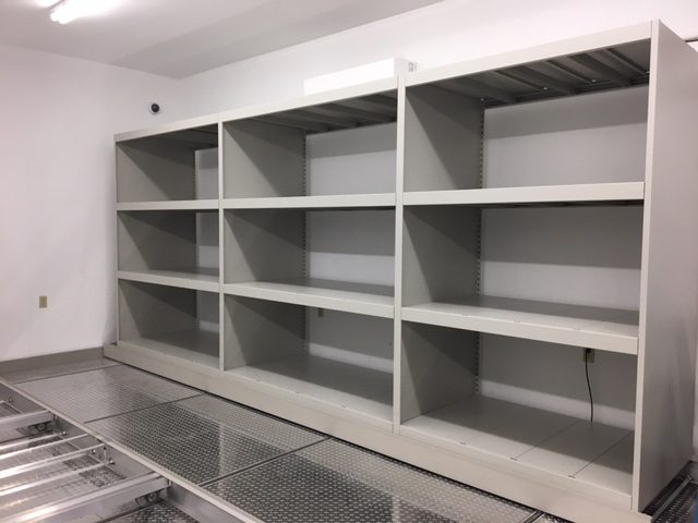 Mobile shelving installation with floor tracks