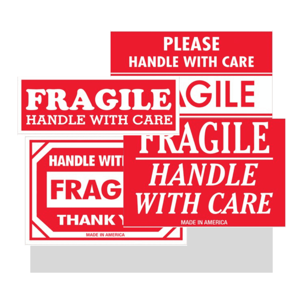 Several red and white Material Handling USA shipping labels with messages like “FRAGILE,” “HANDLE WITH CARE,” and “PLEASE HANDLE WITH CARE” overlap each other in the image.