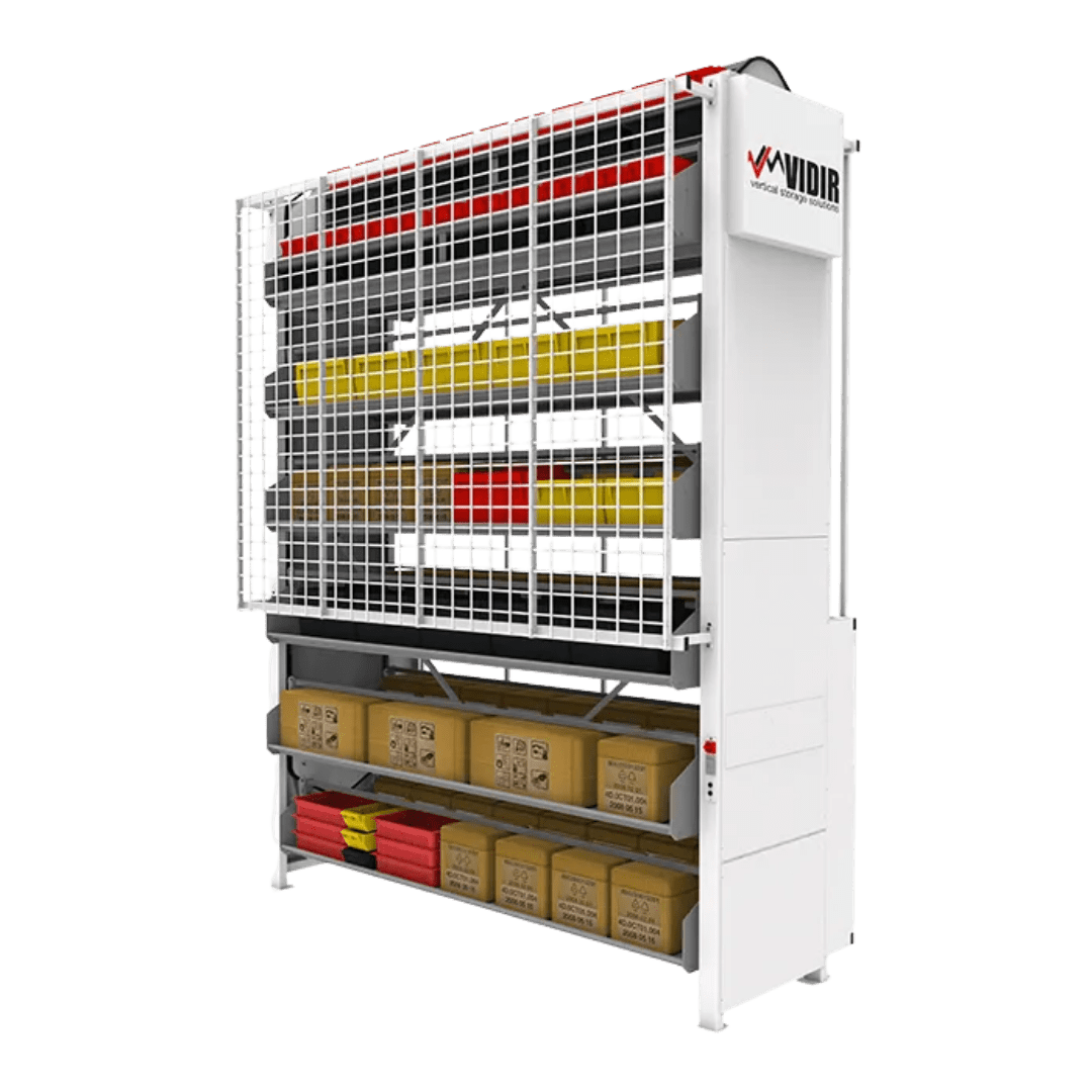 Automated vertical storage system with shelves holding various boxes and containers, enclosed in a white metal frame and safety grid. The Vidir machine features advanced inventory management technology for efficient space optimization.