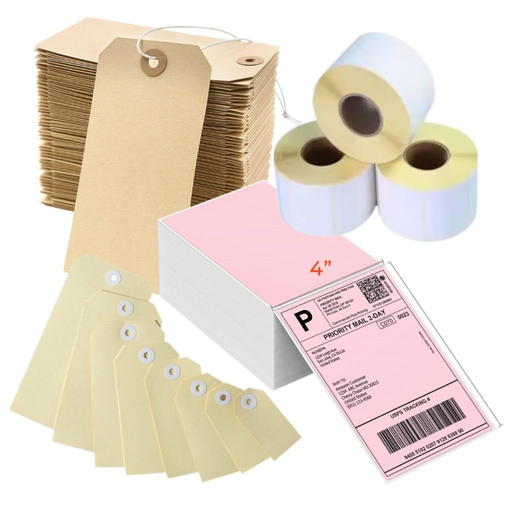 A collection of blank shipping labels, brown paper tags with strings, yellow tags with reinforced holes, and four rolls of adhesive label paper, plus a pink printed shipping label in the foreground.