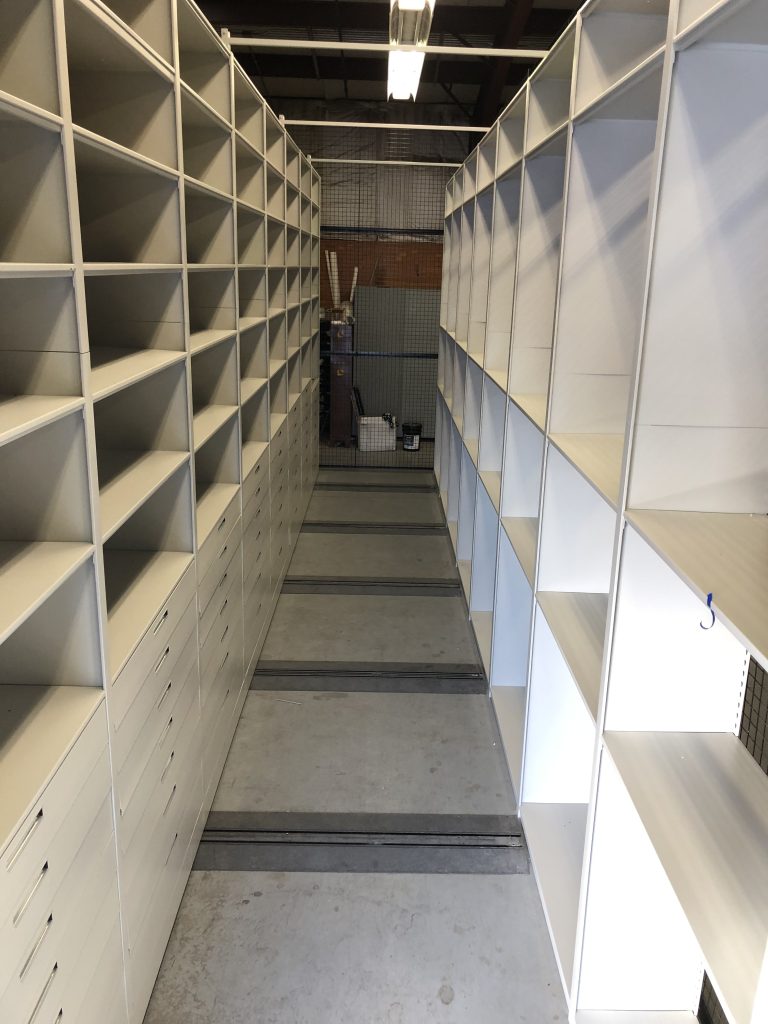Mobile shelving drawer detail with three-spoke handle at South Valley Water Reclamation Facility