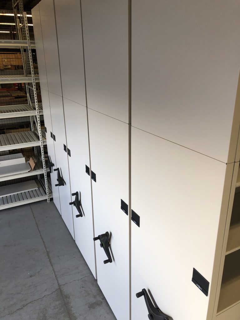 Full system view of mobile shelving at South Valley Water Reclamation Facility showing multiple carriages