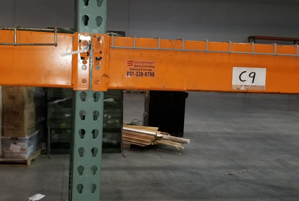 Long wall run of pallet rack with wire decking at Baileys Moving and Storage facility