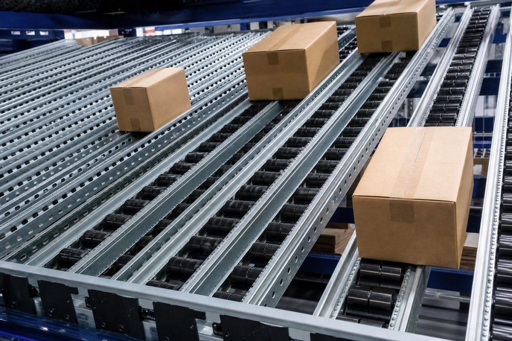 Close-up of carton flow rack roller lanes with cartons flowing to pick face