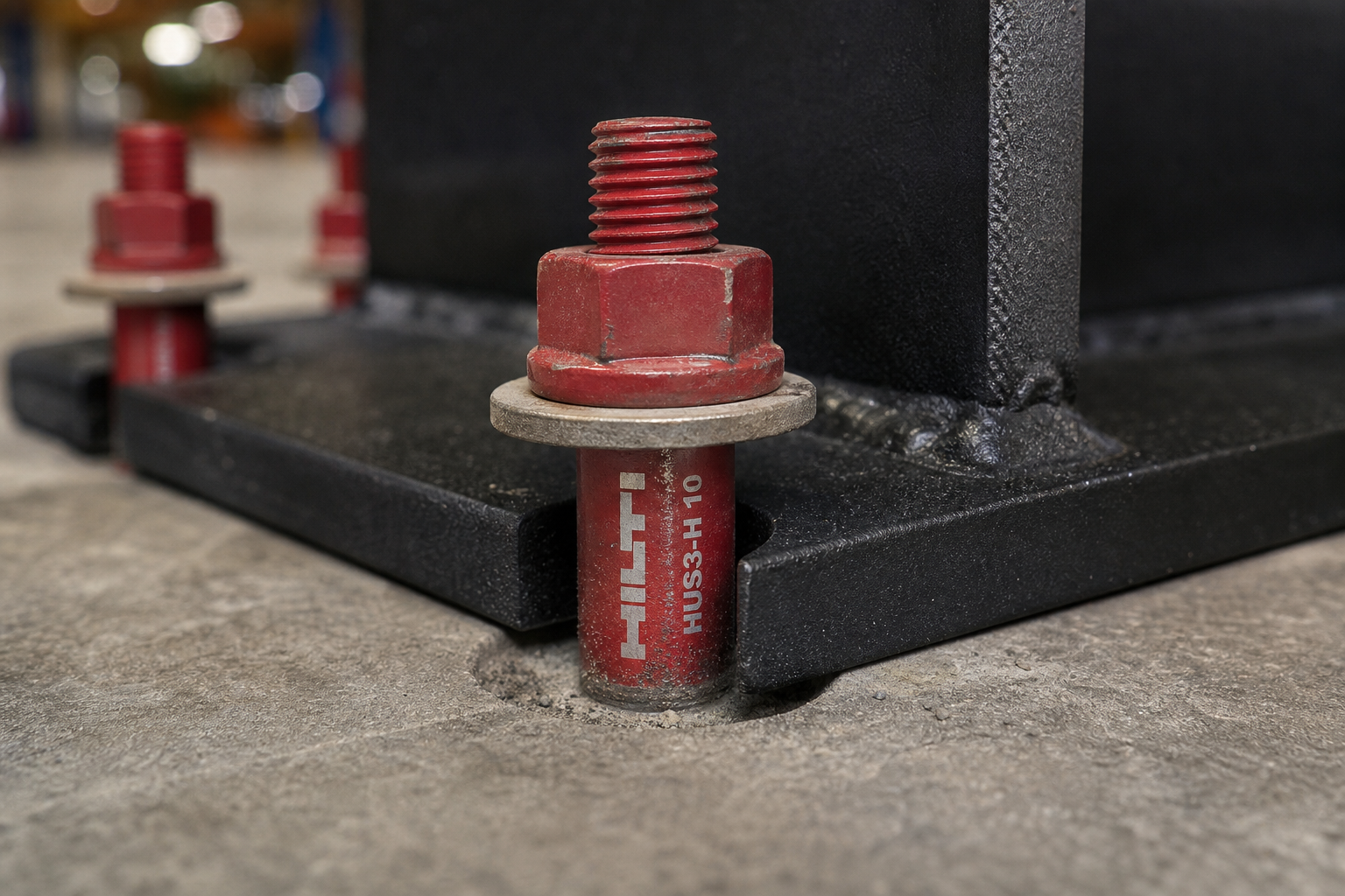 Seismic anchor bolts on pallet rack base plate