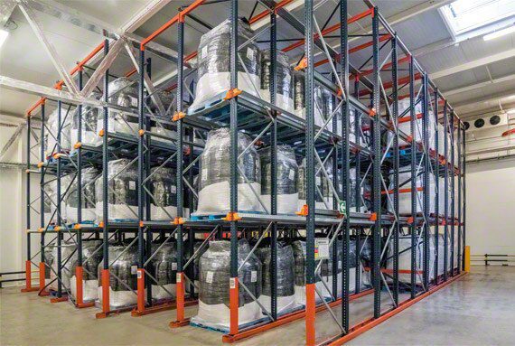 Deep-lane pallet rack block holding wrapped palletized product in a cold storage room