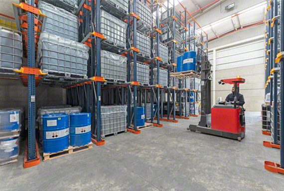 Forklift positioned near high-density pallet storage