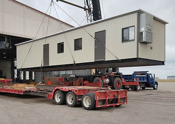 Prefabricated modular building on prepared site