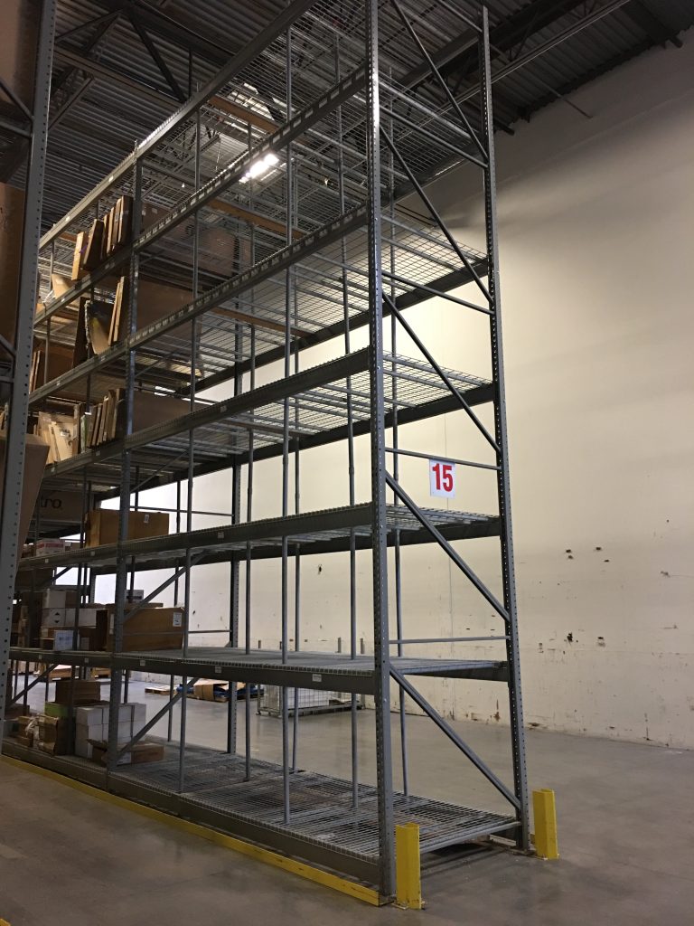 Long pallet rack run identified as row 14 in the Safelite AutoGlass reconfiguration project