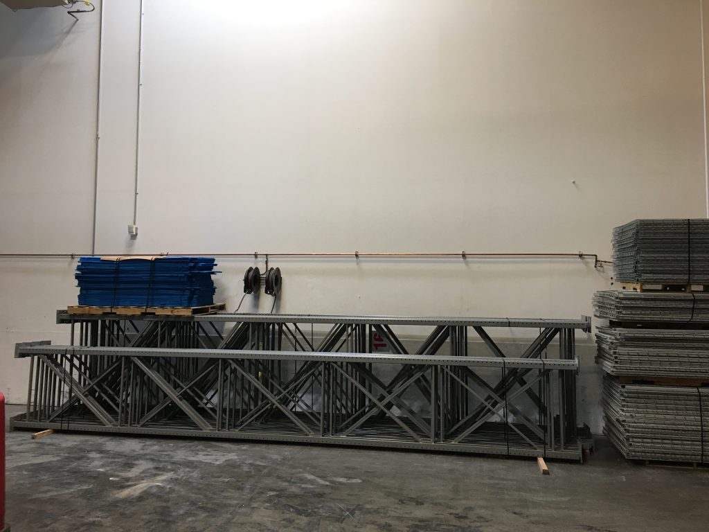 Safelite AutoGlass selective pallet rack installation — wide warehouse view