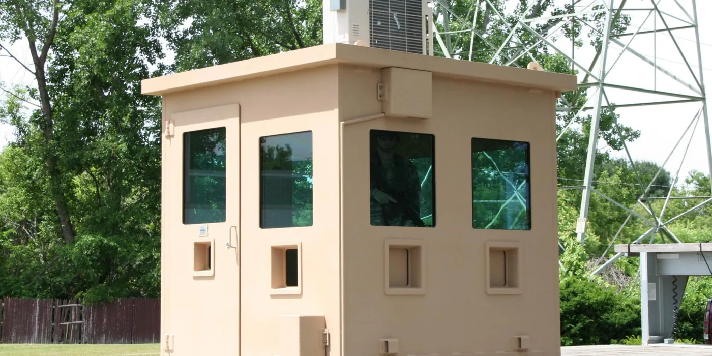 Hurricane-rated prefabricated guard shack with reinforced construction and ballistic glazing