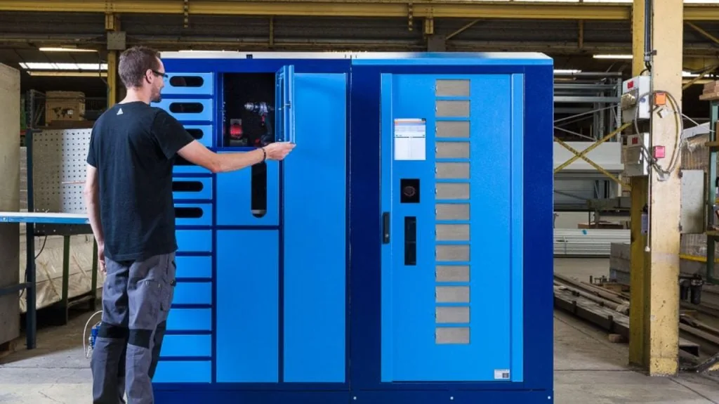 Worker using SupplyPoint system to optimize stock levels with real-time inventory data