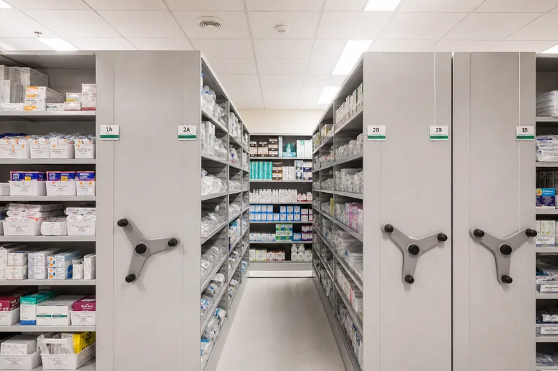 Mobile shelving in a hospital medical supply room with organized inventory