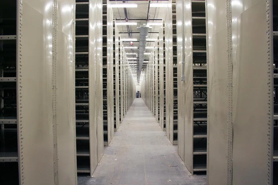 Penco Clipper shelving in back-to-back double rows forming a storage aisle