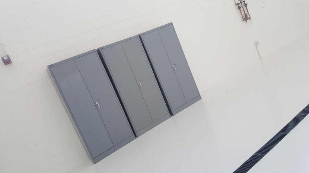 Boltless shelving in a retail stockroom storing inventory and supplies