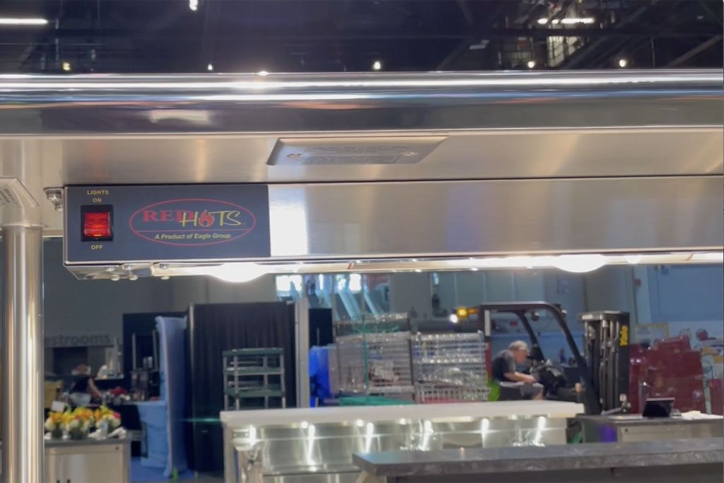 Stainless steel strip heat lamp for a commercial kitchen pass window