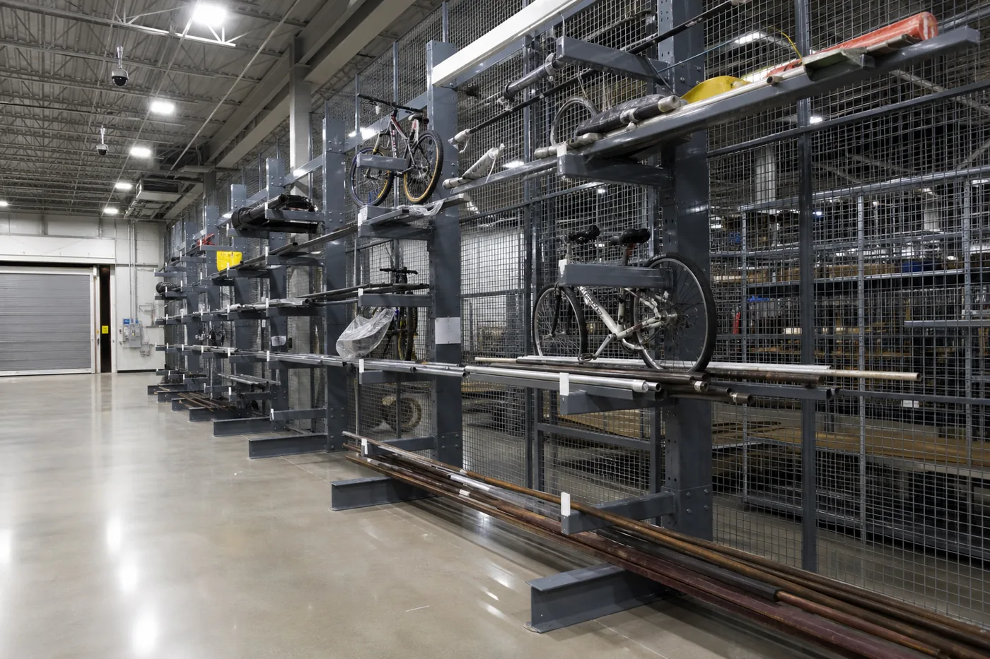 Cantilever racking holding bicycles and long items in a secure bulk evidence storage area