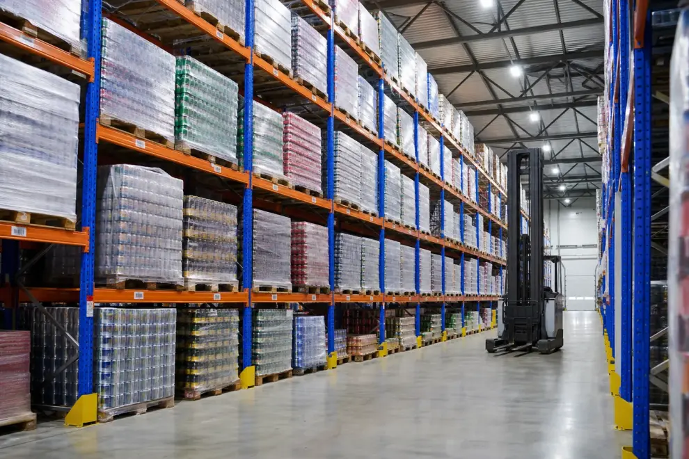 Food and beverage warehouse aisle with pallet racking of cased goods