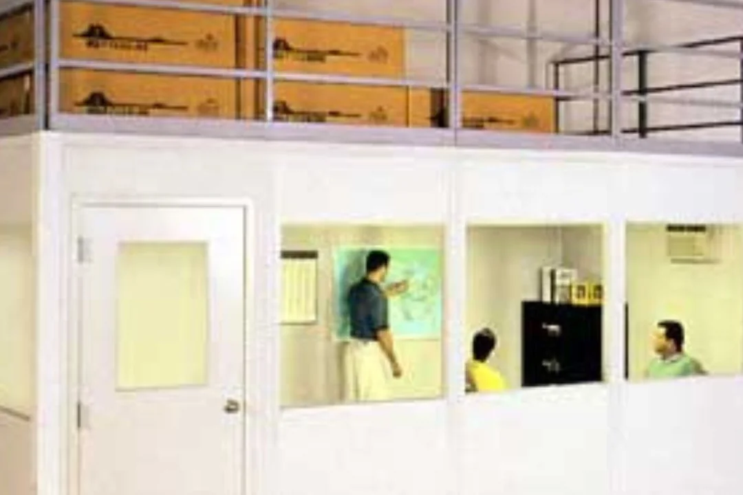 People working in supervisor offices inside a modular in-plant office