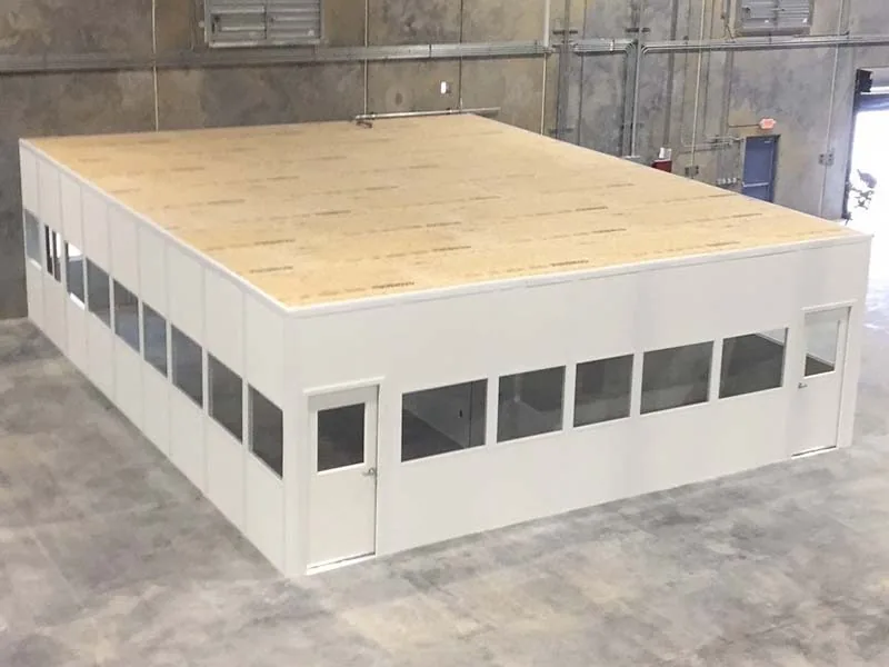 Decking installed over a modular office storage roof inside an industrial building