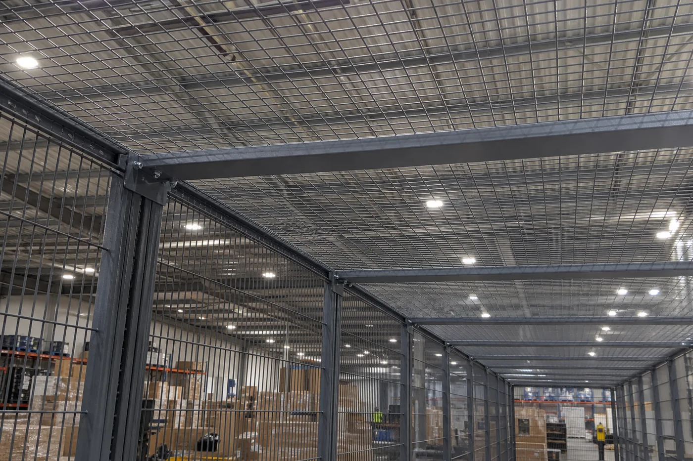 Mesh ceiling and horizontal support tube over a welded wire storage enclosure