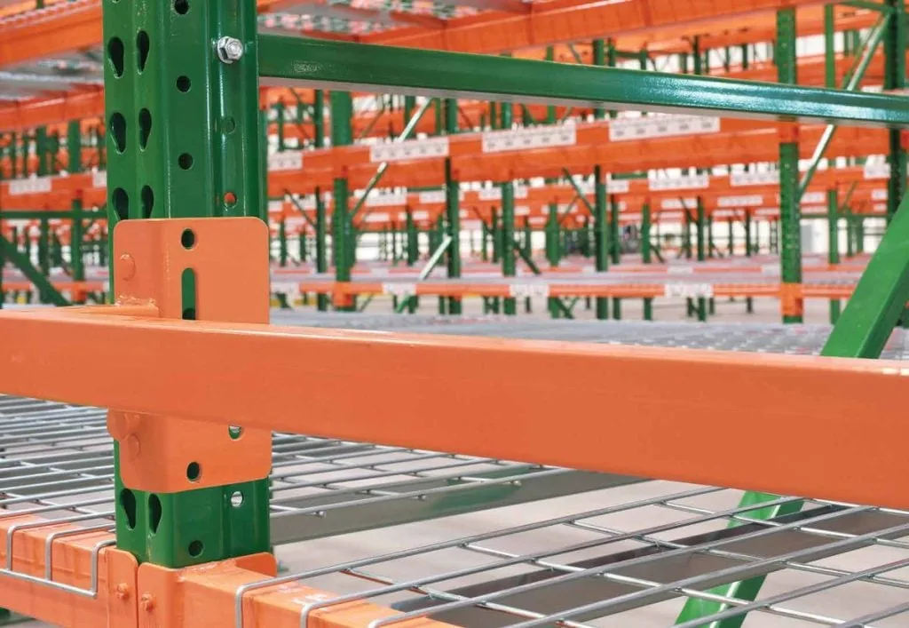 Welded wire deck seated on step beams in a pallet rack bay