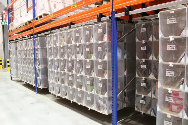 Clear Storeganizer pockets with label holders creating high-density pick faces in pallet rack