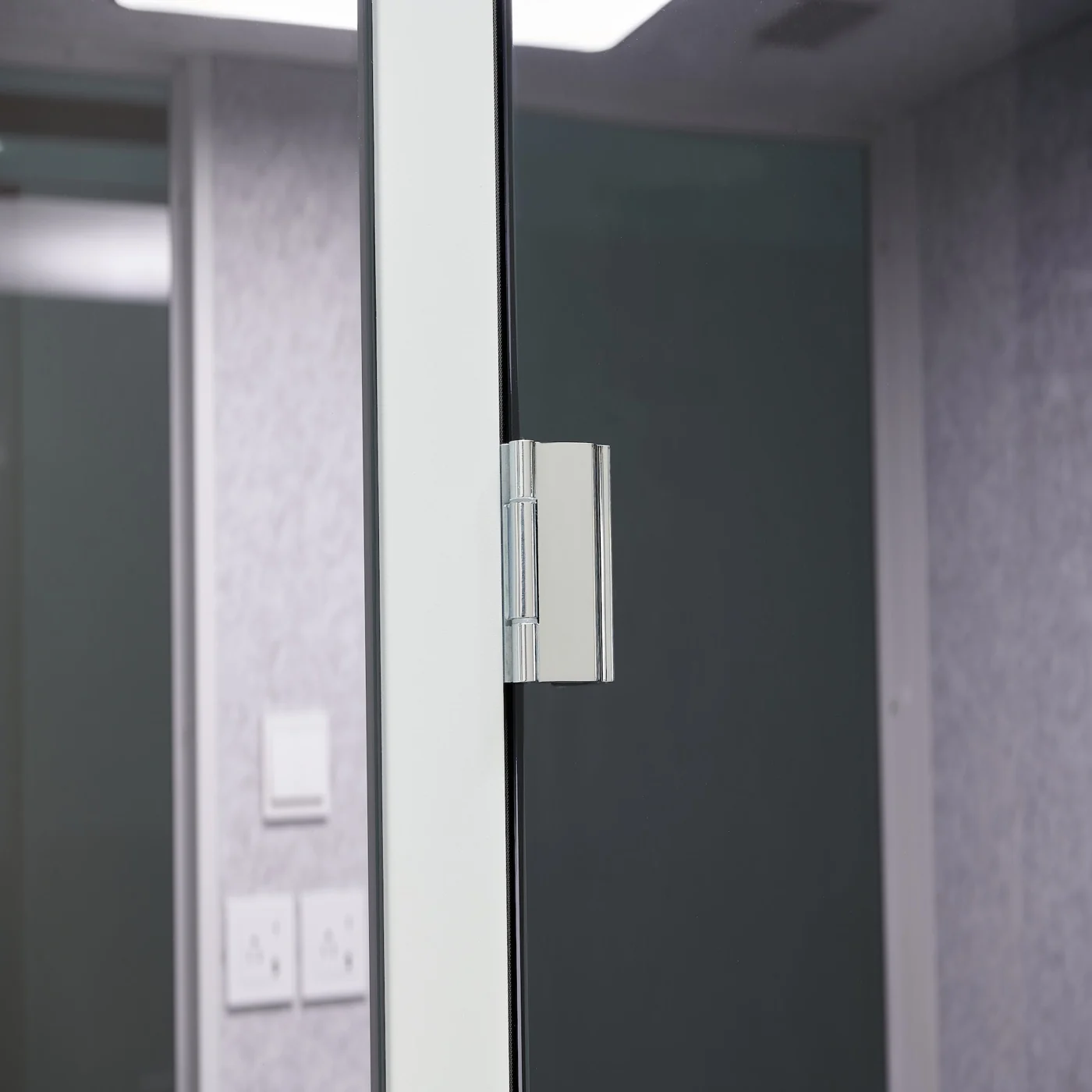 Door latch hardware detail on a Streaming Pods office pod frame