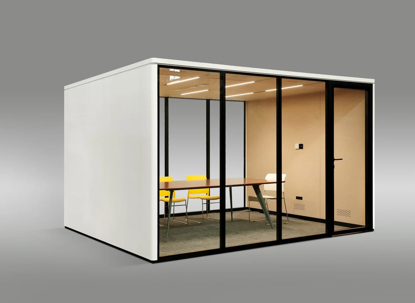 Streaming Pods Reframe modular conference room shown from the corner with glass walls and interior seating