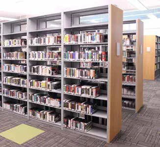 Aurora library shelving book stacks with wood end panels in a school library