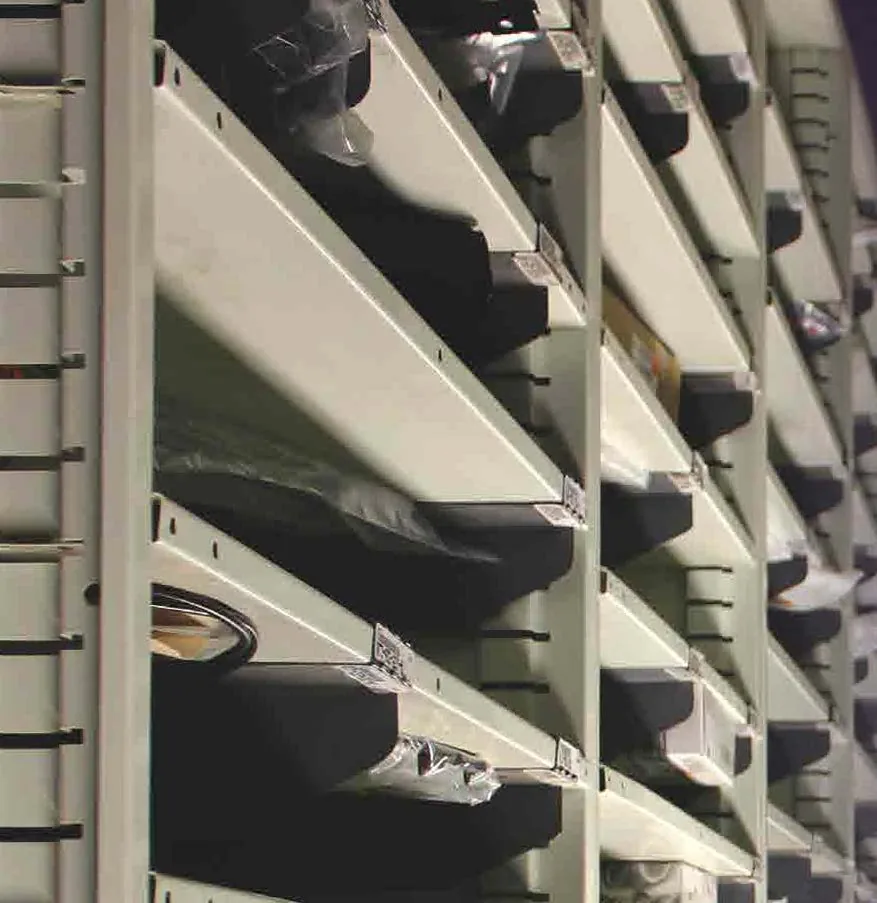Borroughs Flexi-Bin shelves with sliding dividers and labels holding bagged small parts