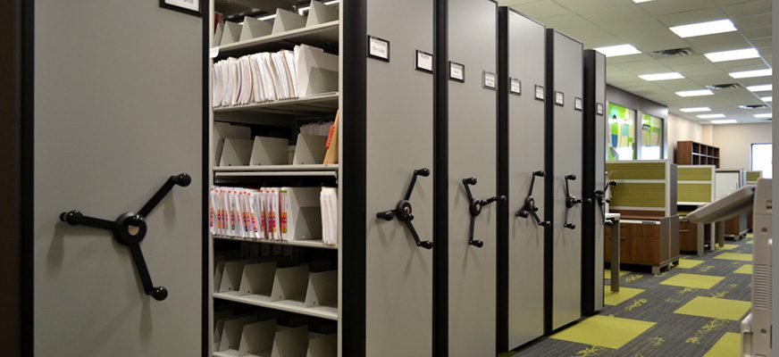 Mizer mechanical mobile shelving carriages in a records file room