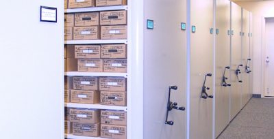 Mizer mobile shelving storing archival microfilm and records boxes