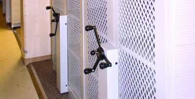 Mizer mobile shelving with expanded metal security mesh end panels for law enforcement evidence storage
