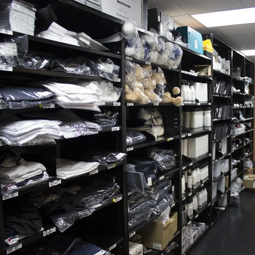 Borroughs shelving with branded apparel and retail merchandise
