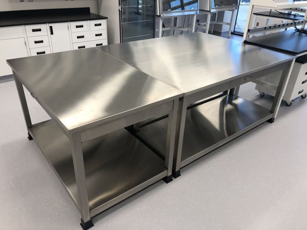 ICI stainless steel worktables with open lower shelves