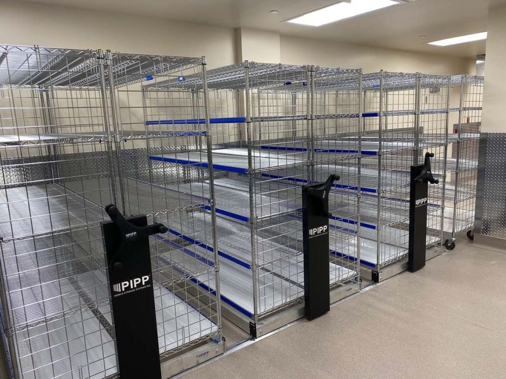 Round-post wire shelving mounted on Pipp mechanical-assist carriages