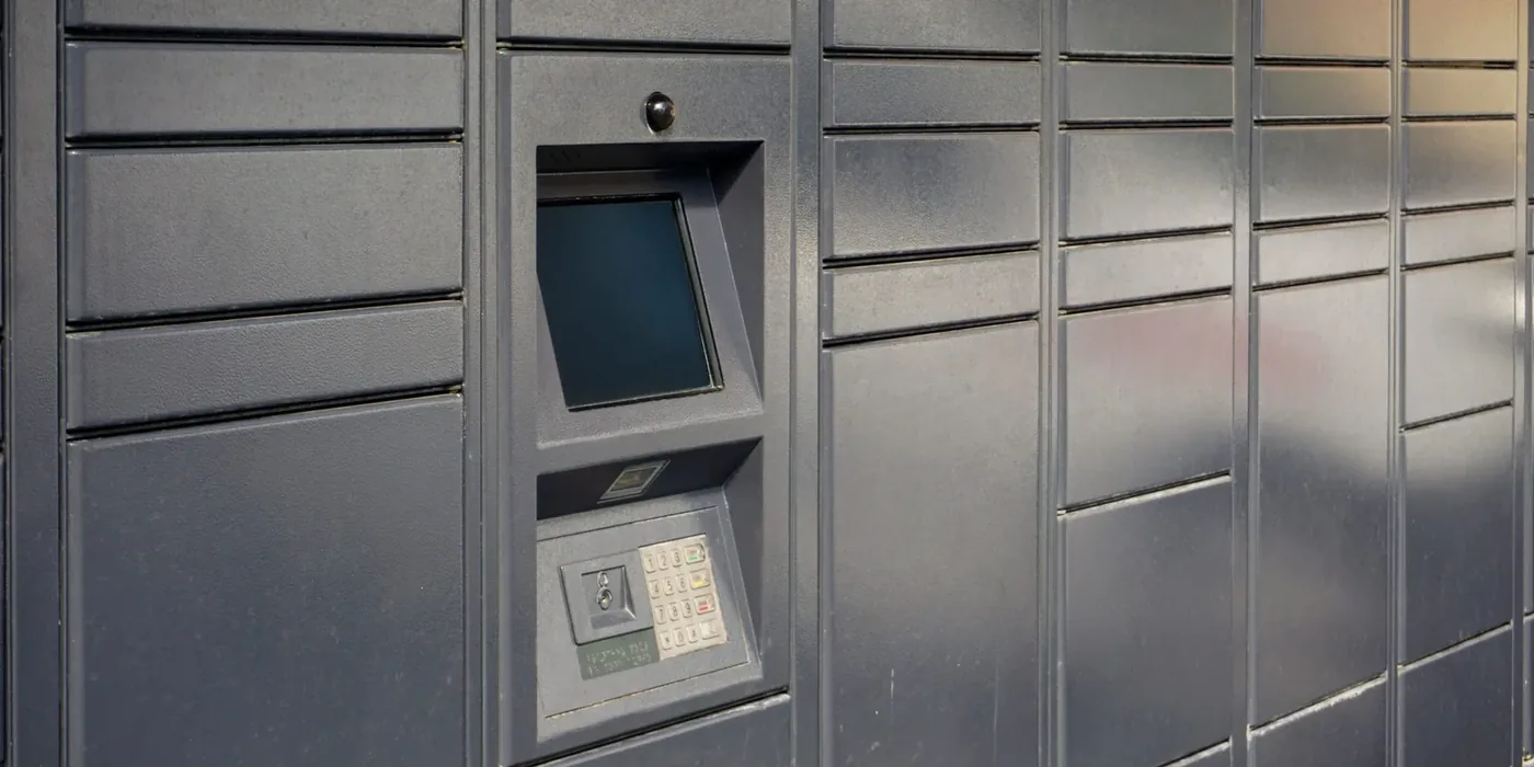 Close-up of a smart locker kiosk with touchscreen, barcode scanner and camera