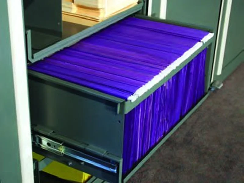 Legal-size hanging files in a Times-2 rollout drawer extended on its suspension slides