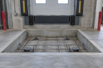Fabricated shallow pit, 24 in. minimum depth, cast into a warehouse dock floor for a fully automatic loading ramp/dock leveler installation