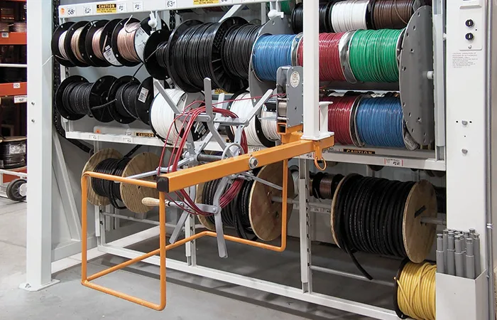 Hanger meter slider measuring wire at the pick opening of a Vidir wire carousel