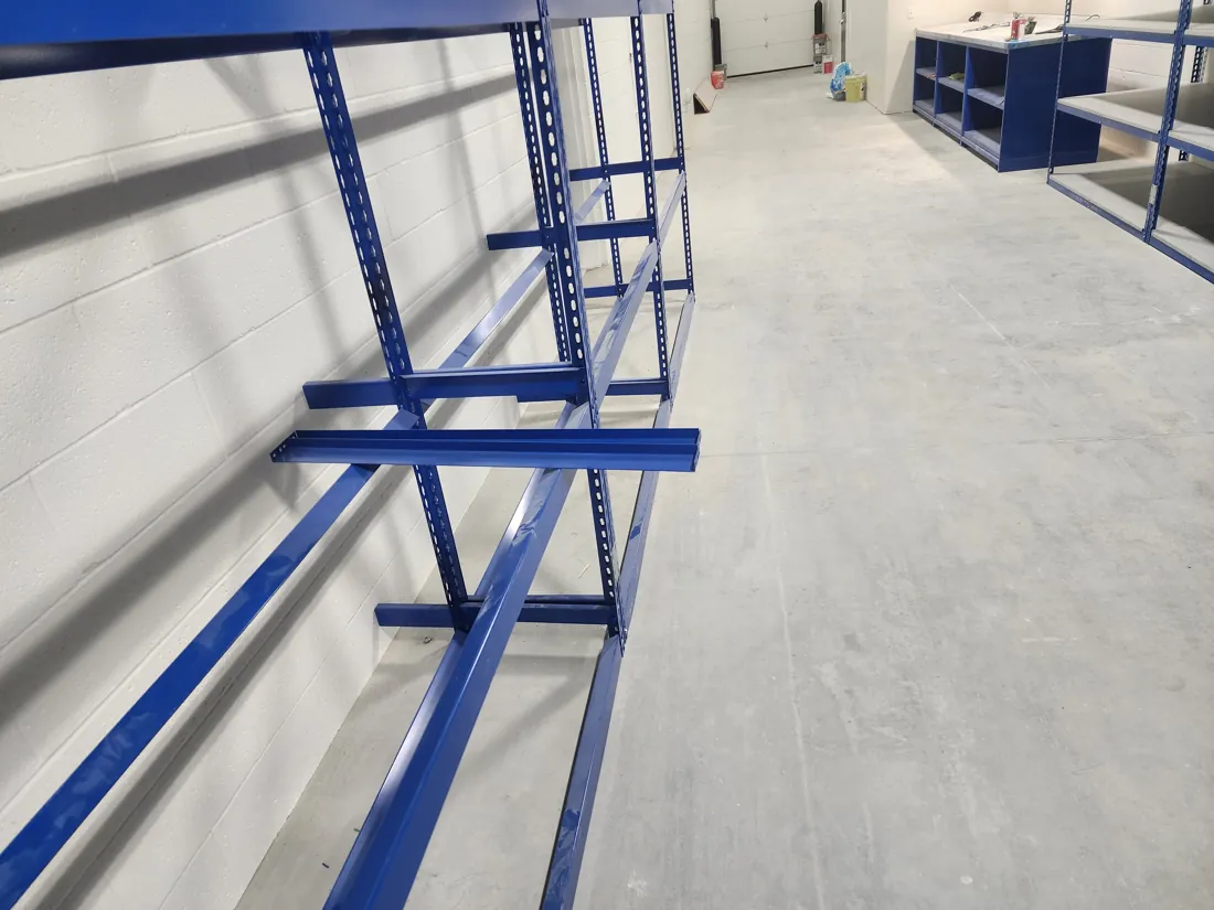 Borroughs Rivet-Span tire storage beams installed along a wall at Young Subaru