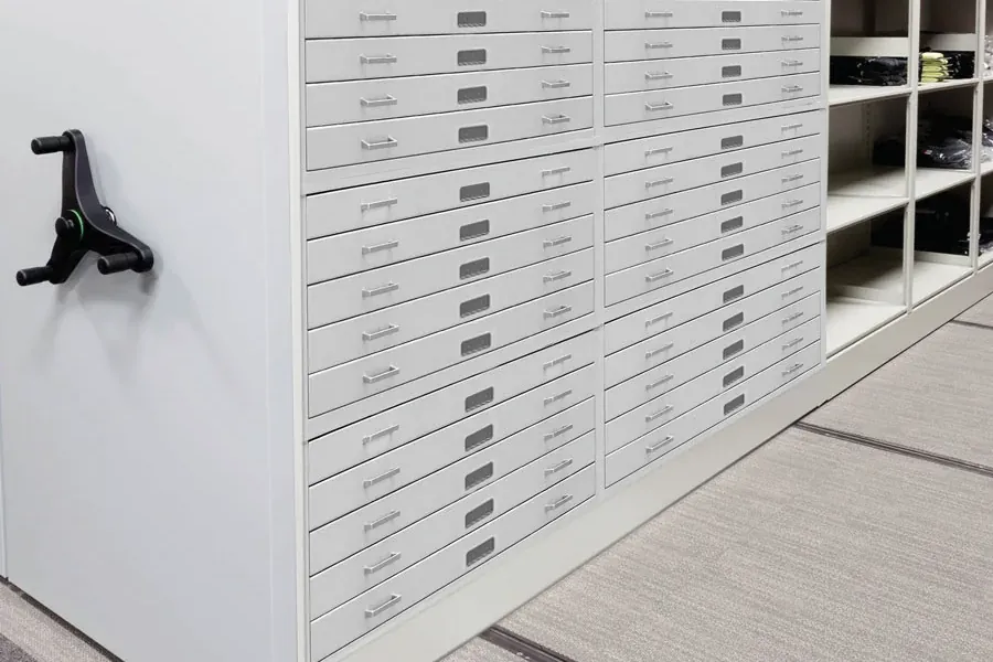 Archival flat file cabinets with shallow drawers for maps, prints and drawings mounted on a mobile shelving carriage with a handwheel and floor rails