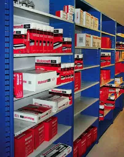 Blue Borroughs Flexi-Bin units with open slide-in shelves holding boxed parts