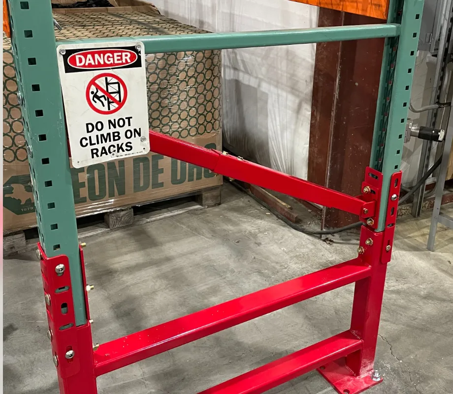 Centurion Row Guard with adjustable brace bolted to teardrop pallet rack uprights at the row end