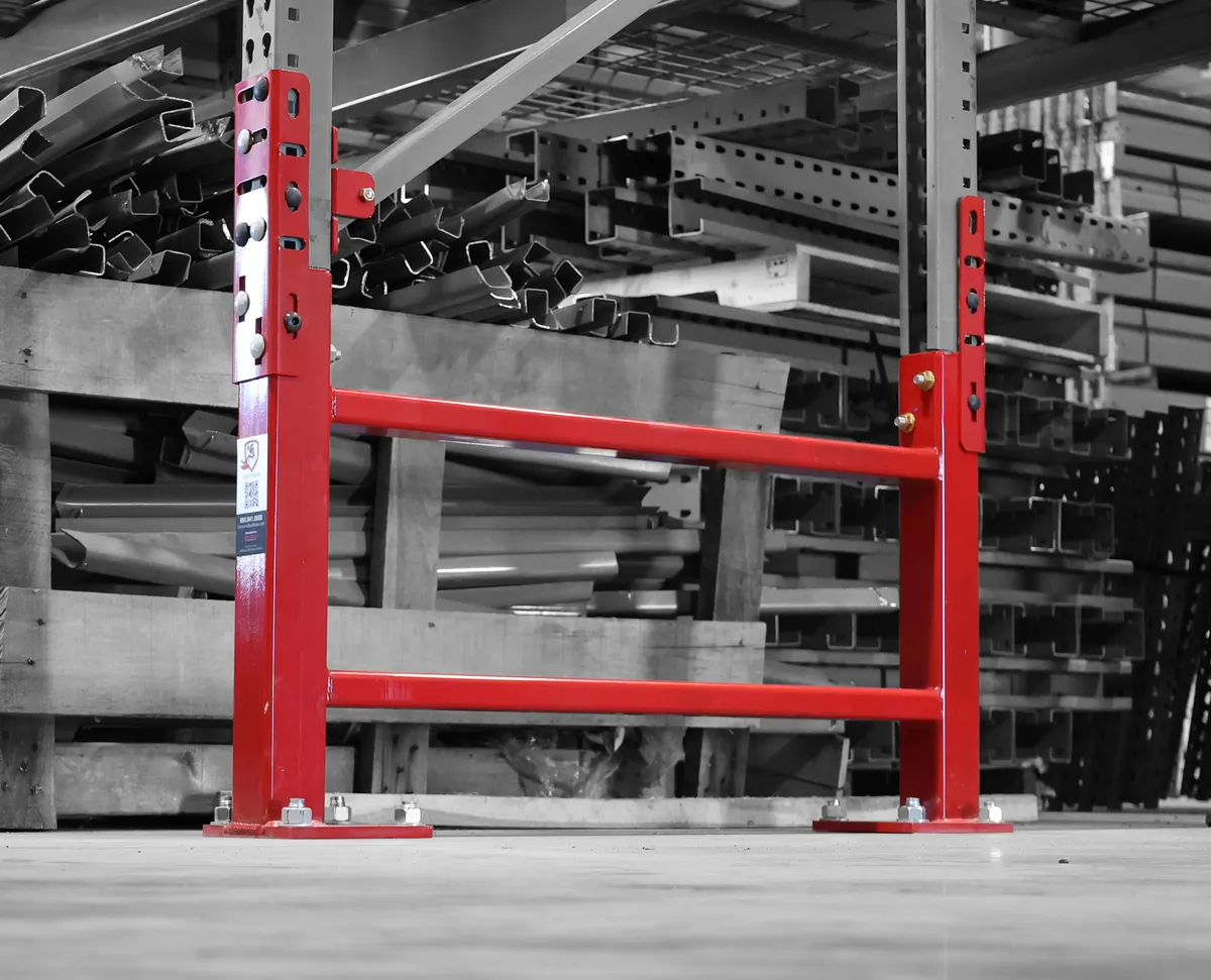 SpaceGuard Centurion Row Guard installed at the end of a pallet rack row, protecting the front and rear uprights