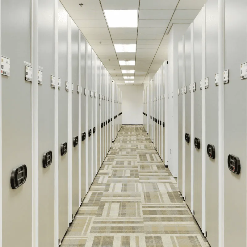 Datum MobileTrak powered mobile shelving carriages closed along a corridor of end panels